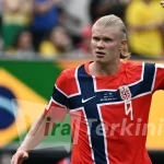 6a4ad8f92de8a-penyerang-norwegia-erling-haaland-usai-cetak-gol-kedua-ke-gawang-brasil-di-16-besar-piala-dunia-2026_gemini_1265_711